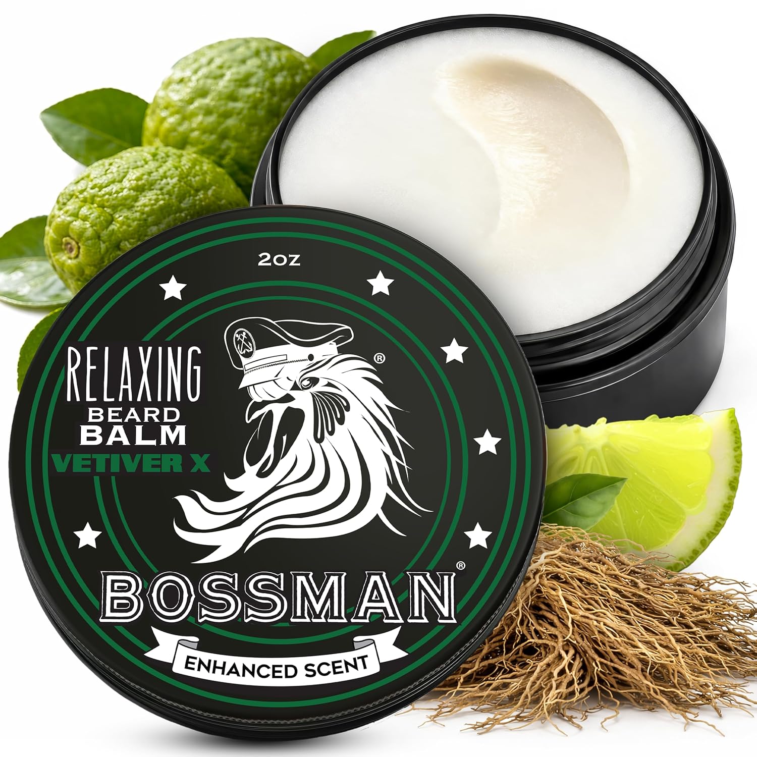 Bossman beard balm container with lid open, showing balm inside, surrounded by green leaves and a lime.
