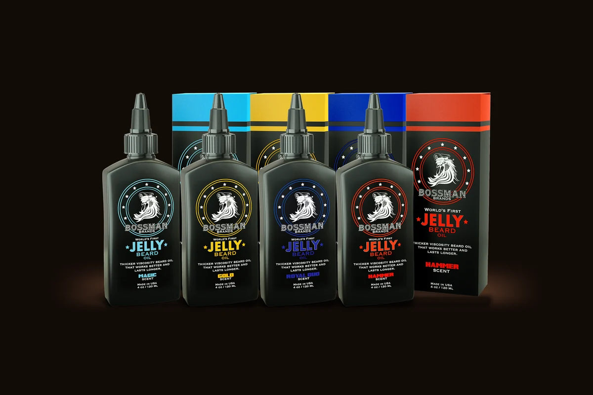 Jelly Beard Oil bottles and boxes in four scents on a dark backdrop
